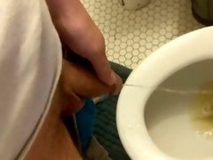 Gently stroking my semi-hard cock while I let the pee flow :)