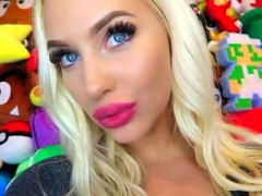 Beautiful blonde model tries on different lipstick on webcam