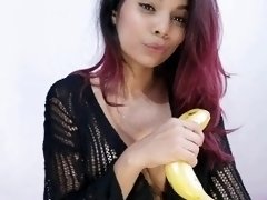 Enjoying a banana. Mila Garcia