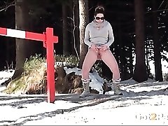 Busty sweater girl pees in the snow