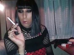 Horny transsexual smokes and masturbates