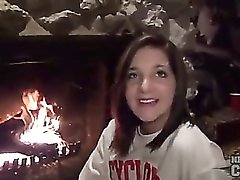 Teenager in front of fireplace has tight body